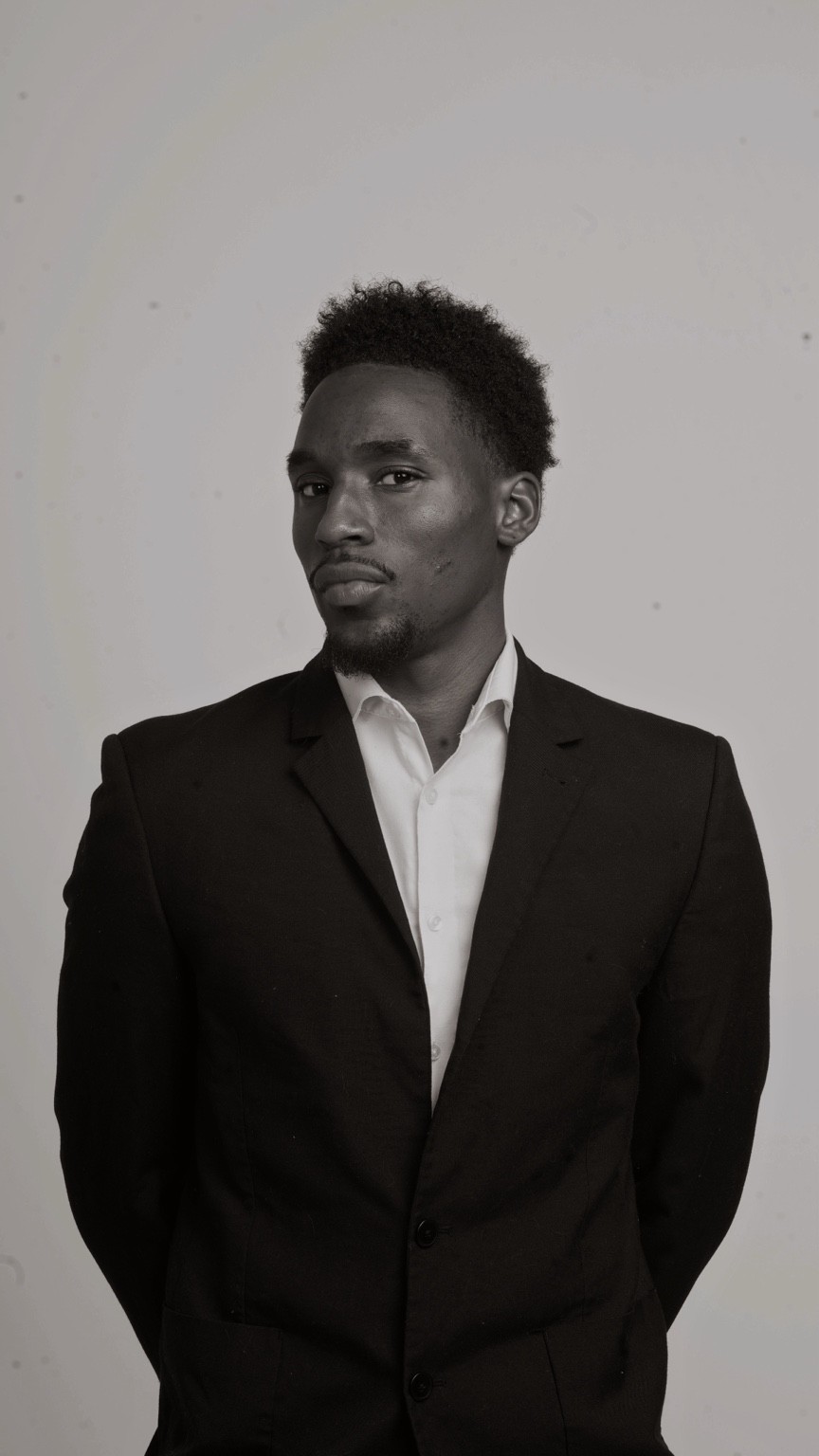 Portrait of Kyyiren Terrell Sharp in a black suit